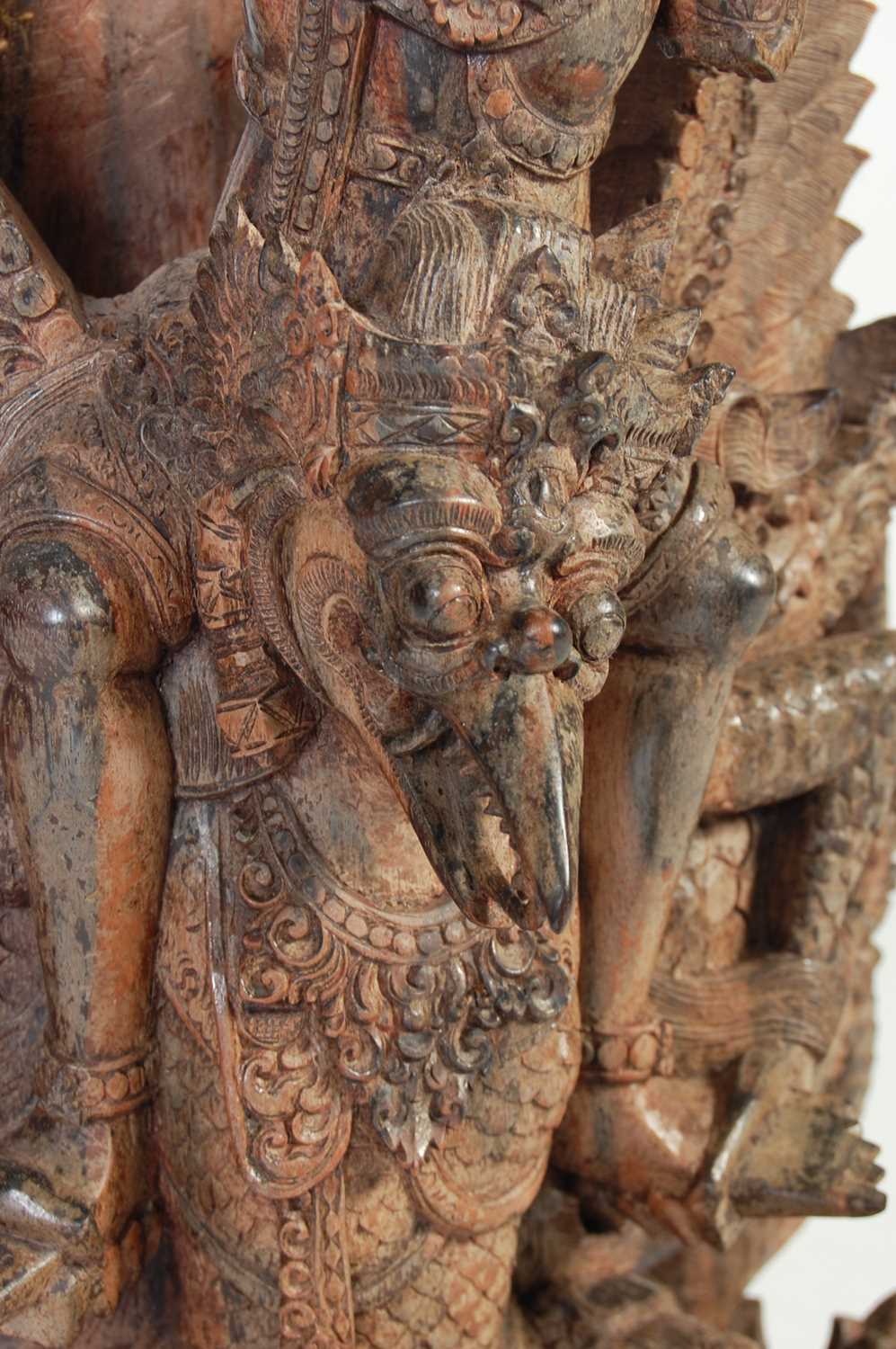 An Indonesian carved hardwood figure of Garuda and dragons, 97.5cm high. - Image 5 of 6