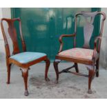 An early 20th century mahogany elbow chair, the scroll carved top rail above a pierced vase shaped