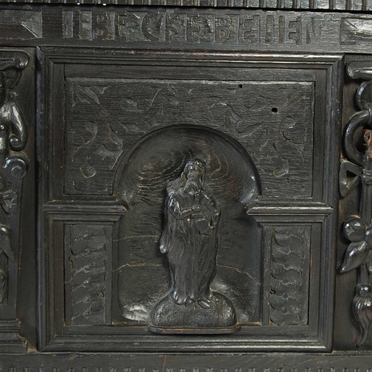 An antique stained oak coffer on integral stand, the hinged cover with two incised figural carved - Image 8 of 13