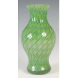A rare and early Monart vase, shape 'M', with green spiral trail and blue dot decoration, with