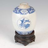 A Chinese porcelain blue and white jar, Qing Dynasty, probably Kangxi Period, the ribbed oviform