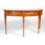 A 19th century mahogany and boxwood lined demi lune console/ serving table, the shaped top above a