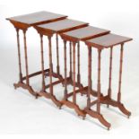 A quartetto of Regency style mahogany occasional tables, the rectangular tops raised on four ring-