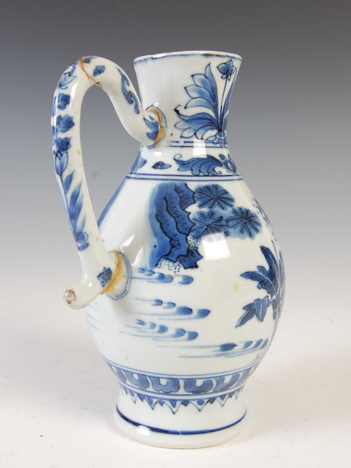 A Chinese porcelain blue and white jug, Qing Dynasty, decorated with three figures in a fenced - Image 2 of 10