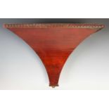 A 19th century mahogany and pine wall bracket, the rectangular shelf on tapered concave support,