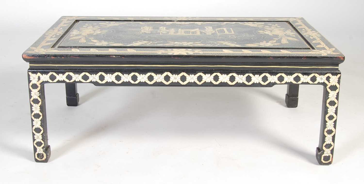 A Chinese black lacquer chinoiserie decorated coffee table, the rectangular top decorated with - Image 8 of 8