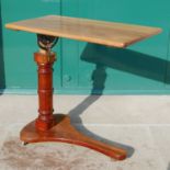 A late 19th / early 20th century mahogany bed table, the adjustable rectangular top resting on a