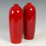 A pair of Royal Doulton Flambe vases, impressed and printed marks, 23cm high.