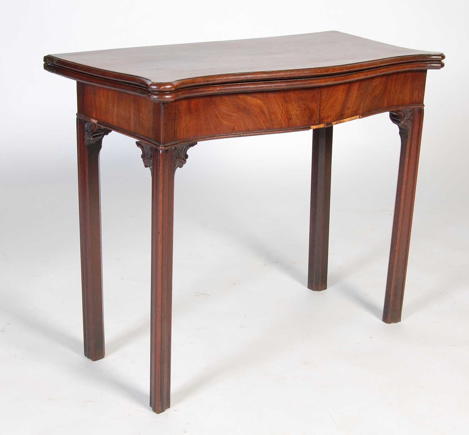 A George III mahogany serpentine card table, the shaped top with moulded edge opening to a green - Image 2 of 12