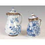 Two Chinese porcelain blue and white, white metal mounted sparrow beak jugs and covers, Qing