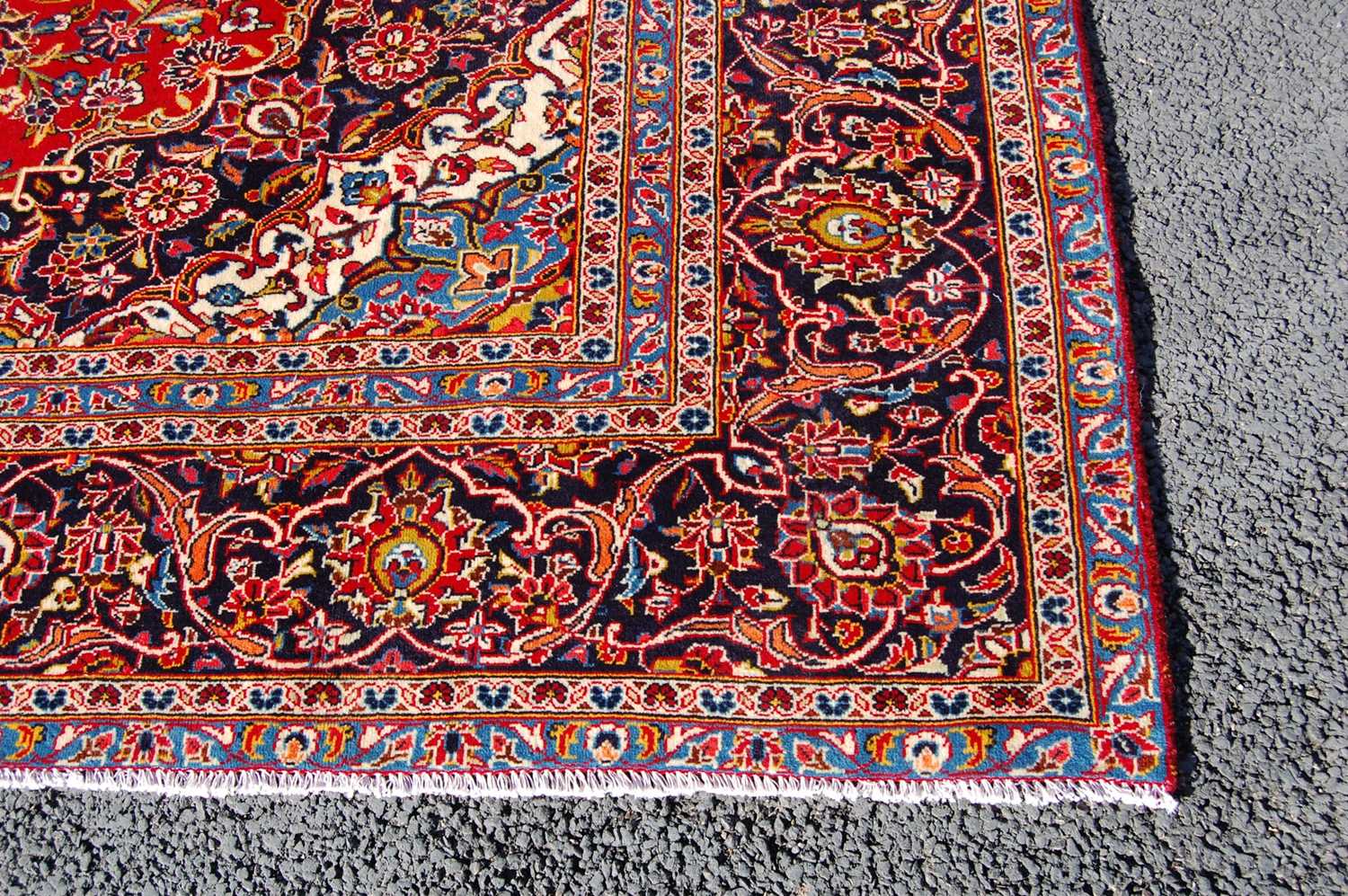 A Persian Kashan carpet, the rectangular field centred with a blue ground oval medallion within a - Bild 4 aus 10
