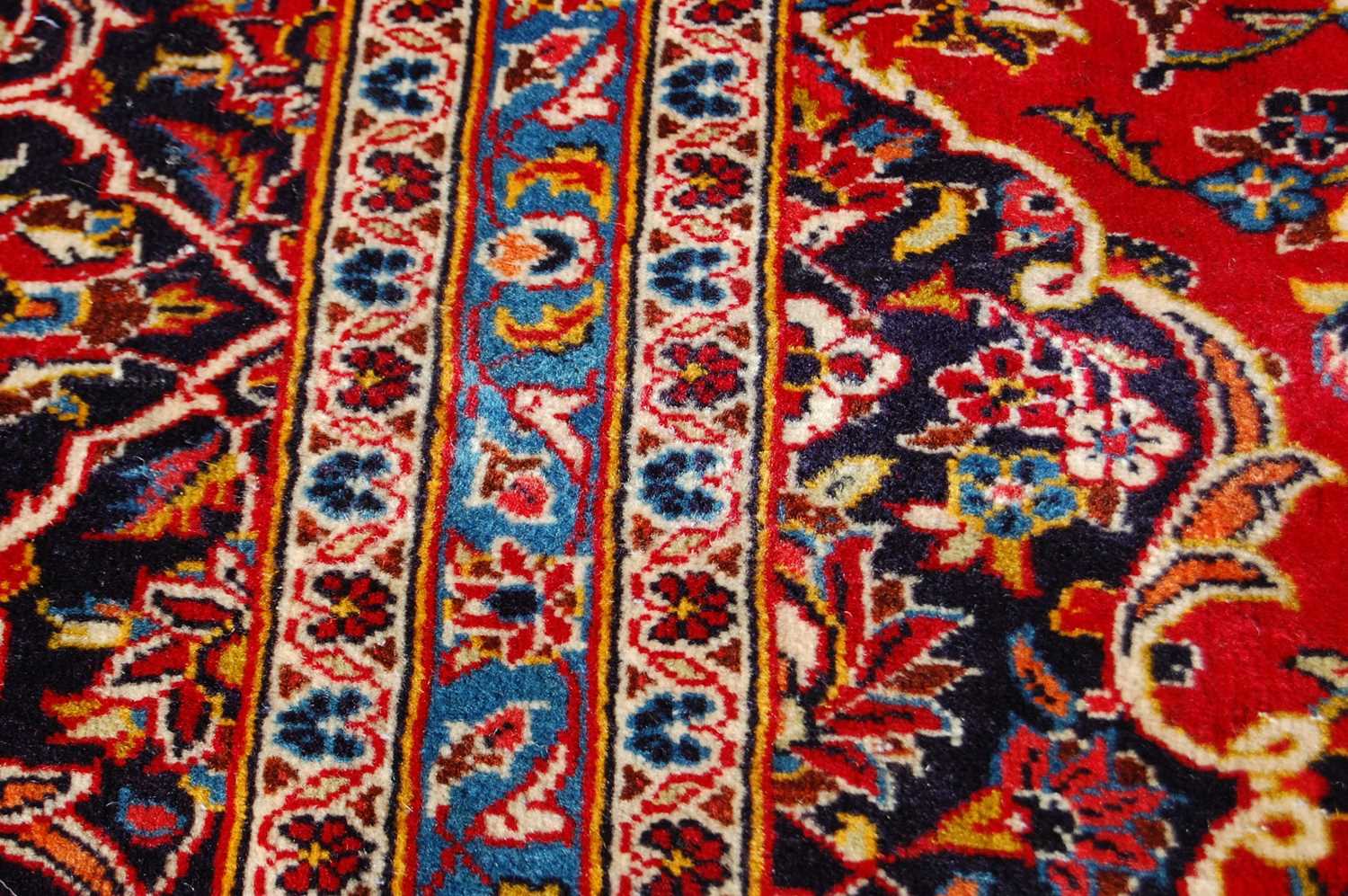 A Persian Kashan carpet, the rectangular field centred with a blue ground oval medallion within a - Bild 9 aus 10