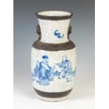 A Chinese porcelain blue and white crackle glazed vase, Qing Dynasty, decorated with fenced garden