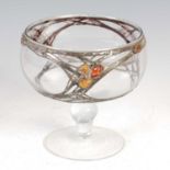 An early 20th century Arts & Crafts style clear glass pedestal bowl with pewter and amber overlay,