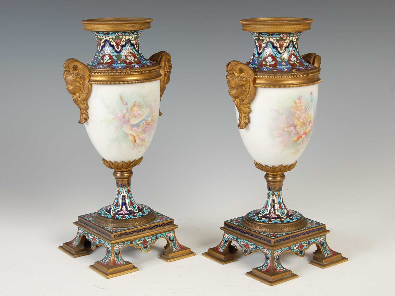 A pair of gilt metal mounted hand-painted porcelain urns, decorated with classical maidens and - Image 2 of 8