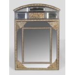 A large late 19th century ebonised and brass mounted cushion framed wall mirror, set with eight