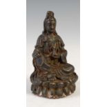 A small Chinese bronze figure of Guanyin, modelled on lotus throne, 9cm high