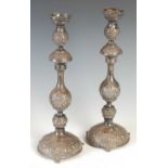 A pair of Victorian silver Sabbath candlesticks, London, 1894, makers mark of AK, with embossed