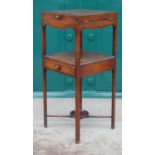 A George III mahogany washstand, the hinged rectangular top opening to a fitted interior with pewter