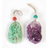 Two antique Chinese carved stone pendants, comprising a spinach jade pendant carved and pierced with