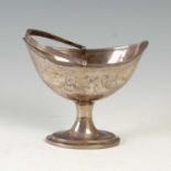 A George III Irish silver oval-shaped basket, Dublin, 1795, engraved with ribbon-tied floral