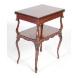 An Edwardian mahogany card table, the hinged rectangular top with moulded edge revolving and opening