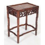 A Chinese dark wood occasional table, late 19th/ early 20th century, the rectangular panel top above