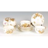 A Mintons part tea and coffee set, with richly gilded and silvered decoration of fruiting branches