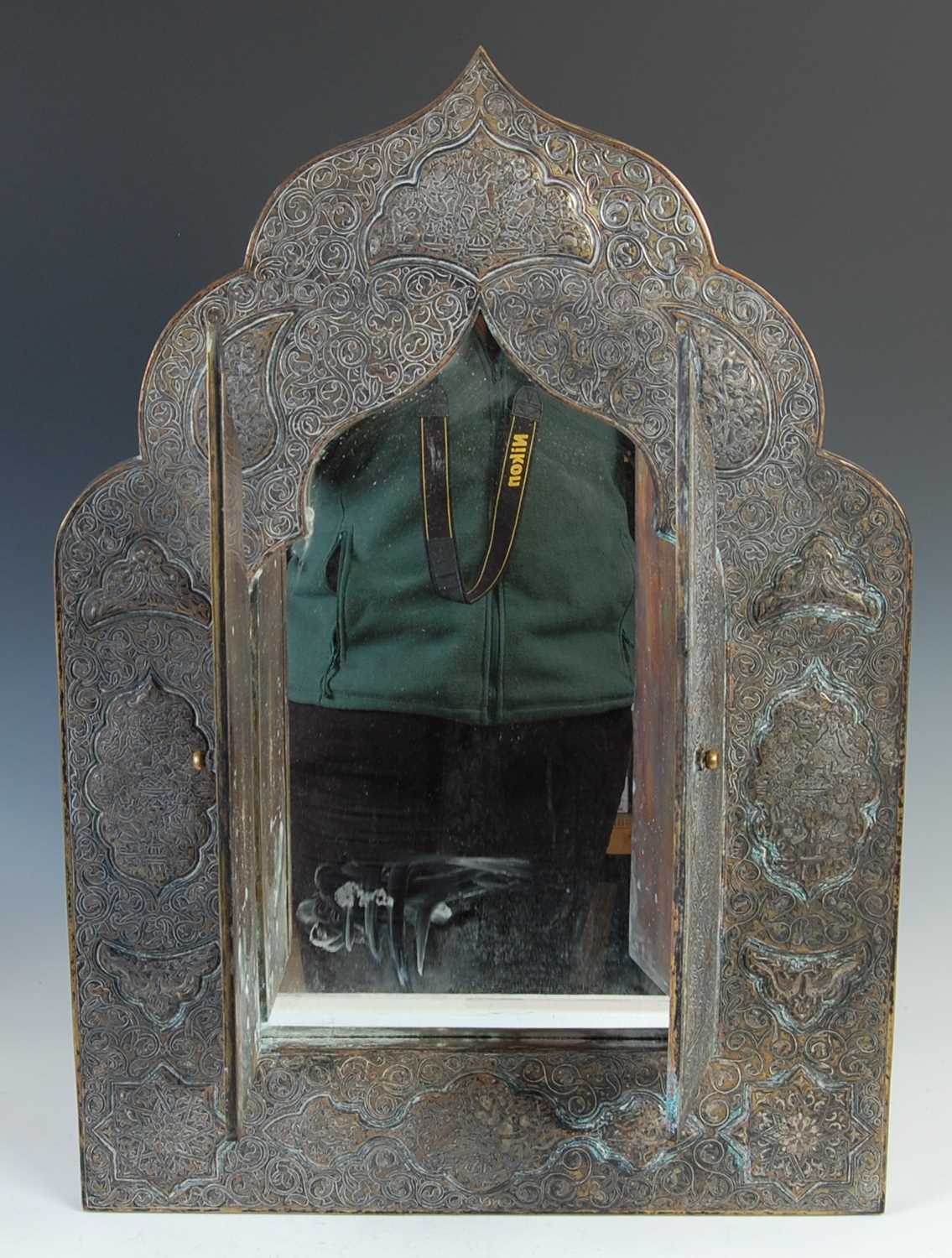A 19th century Persian brass, copper and white metal inlaid mihrab shaped wall mirror, with a pair - Image 4 of 5