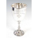 A late Victorian silver presentation goblet, Birmingham, date letter rubbed, makers mark of FE, with