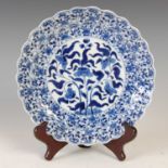 A Chinese porcelain blue and white flower shaped dish, Qing Dynasty, decorated with central