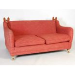 A Country House style drop-end sofa, the rectangular seat with two loose cushions and drop-end arms,