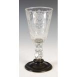 An 18th century Dutch wine glass, the deep tapered cylindrical bowl with engraved armorial crest and