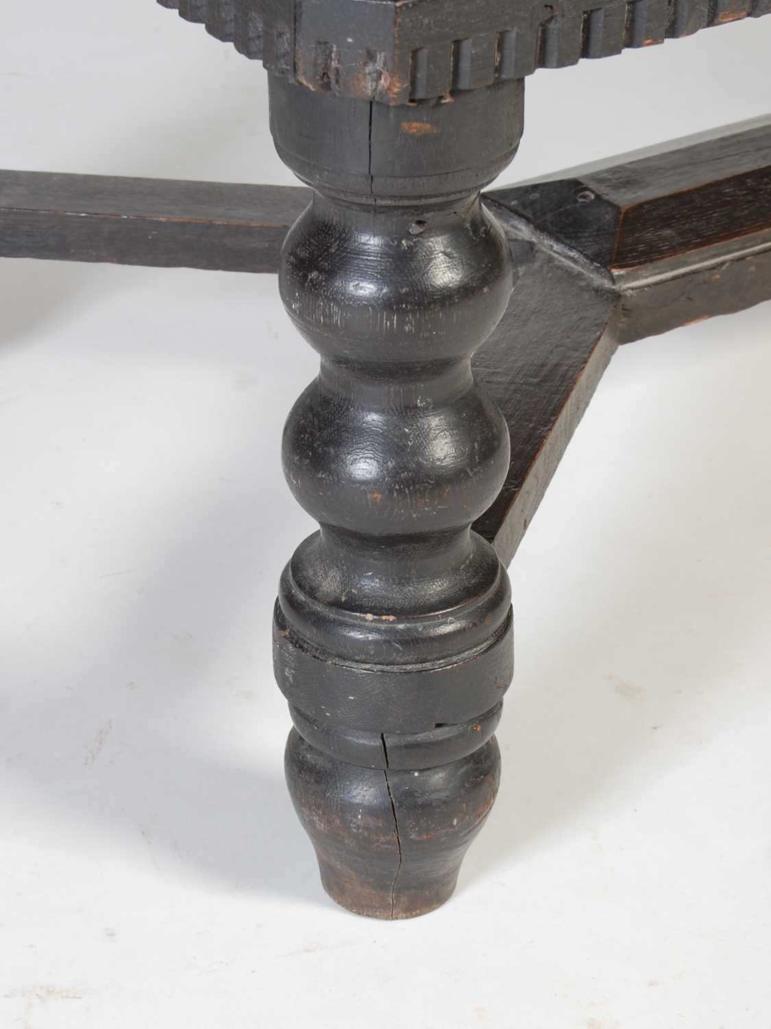 An antique stained oak coffer on integral stand, the hinged cover with two incised figural carved - Image 6 of 13