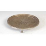 An antique Portuguese silver salver, Porto, of circular form raised on three claw and ball feet,