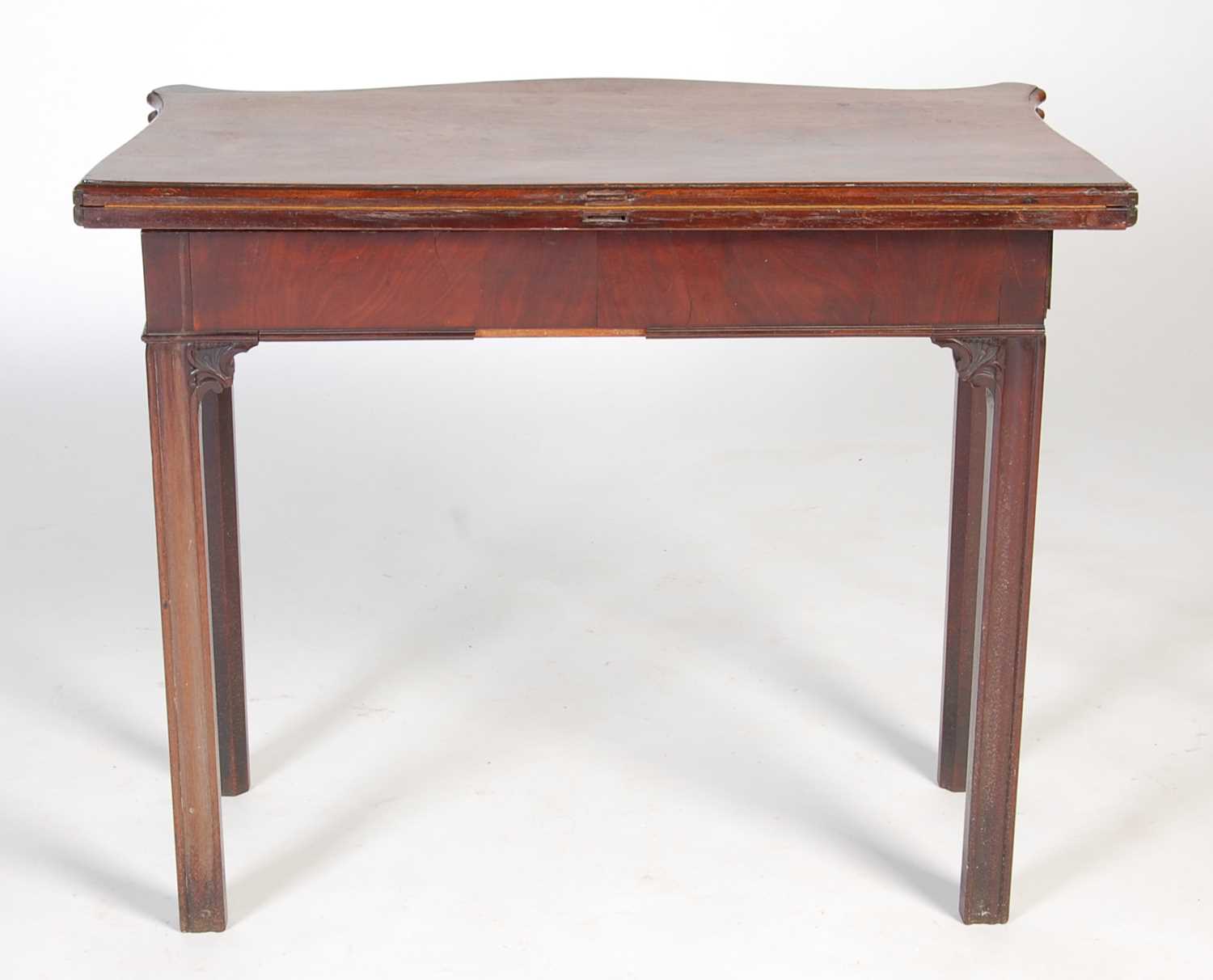 A George III mahogany serpentine card table, the shaped top with moulded edge opening to a green - Image 11 of 12