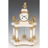 A late 19th century French white marble gilt metal mounted mantel clock, the circular convex