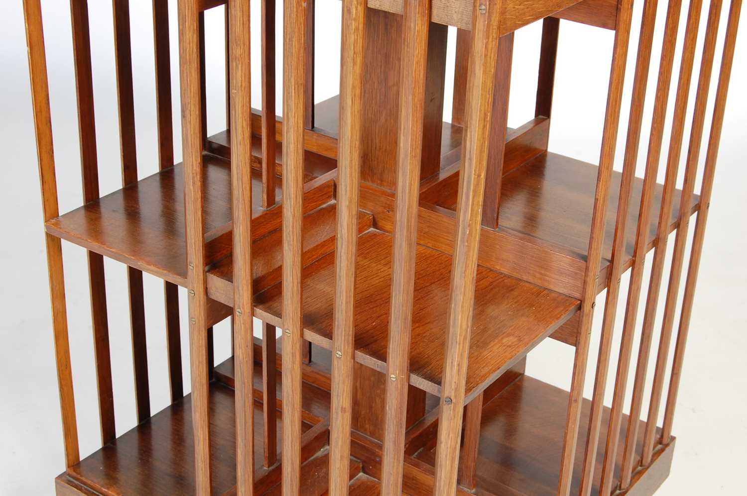 A late 19th/ early 20th century oak revolving bookcase, the square hinged top opening to a book rest - Image 3 of 7