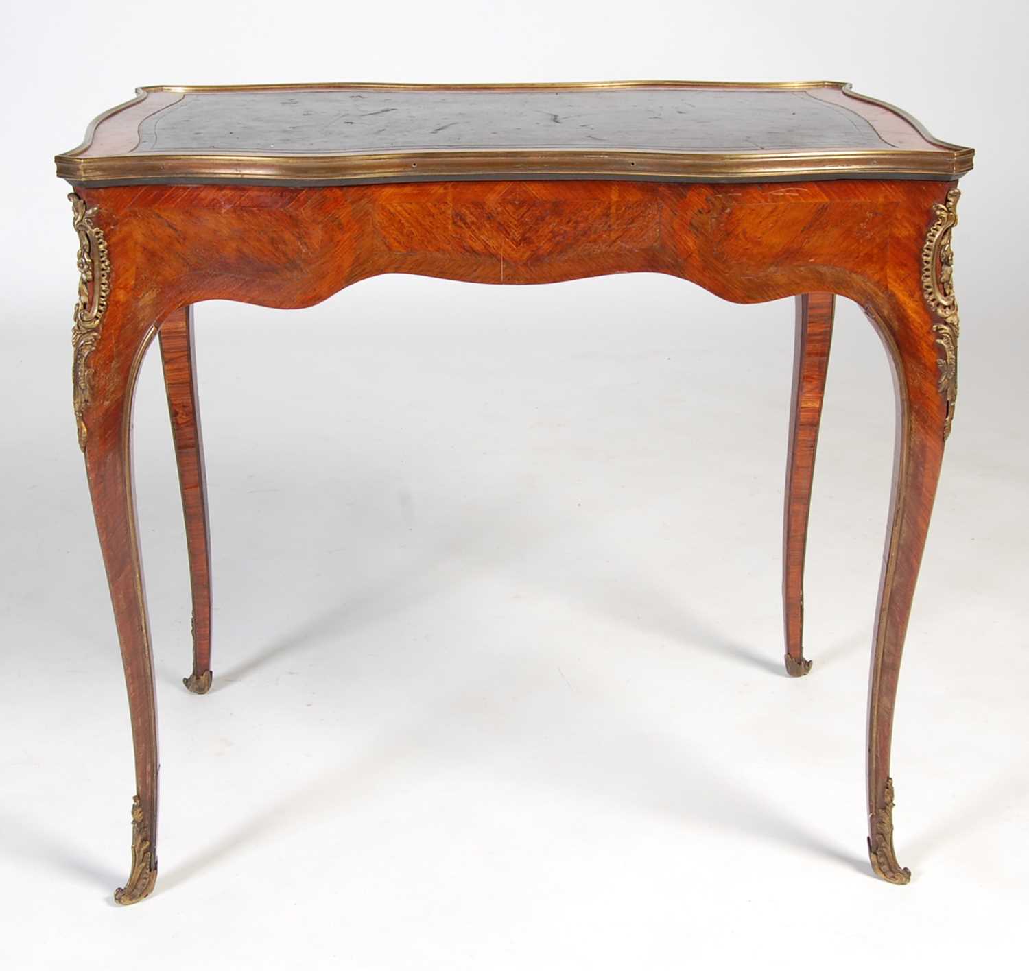 A late 19th/ early 20th century rosewood and gilt metal mounted writing table, the rectangular top - Image 12 of 12