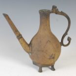 An antique Persian bronze ewer, 18th/ 19th century, the pear-shaped body with teardrop shaped panels