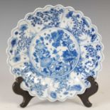 A Chinese porcelain blue and white flower-shaped dish, Qing Dynasty, decorated with central