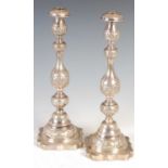 A pair of George V silver candlesticks, London, 1921, makers mark of Sigmund Zyto, with one