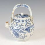 A Chinese blue and white porcelain tea kettle and cover, decorated with long-tailed birds, peony and