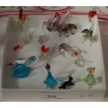 A small collection of clear and coloured glass animals.