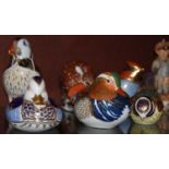 A group of six Royal Crown Derby animal figure paperweights comprising, armadillo, pelican, blue