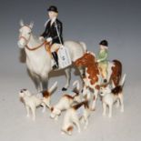 A collection of Beswick figures to include female hunter on dappled grey horse, young girl hunter on