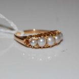 A late 19th/ early 20th century 15ct gold and split pearl ring, gross weight 3.1 grams, ring size '