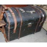 A 19th century wood and leather bound dome top travel trunk / steamer trunk
