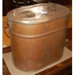 A vintage oval copper two handled vat and cover