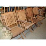 A garden drop leaf table and four folding garden chairs.